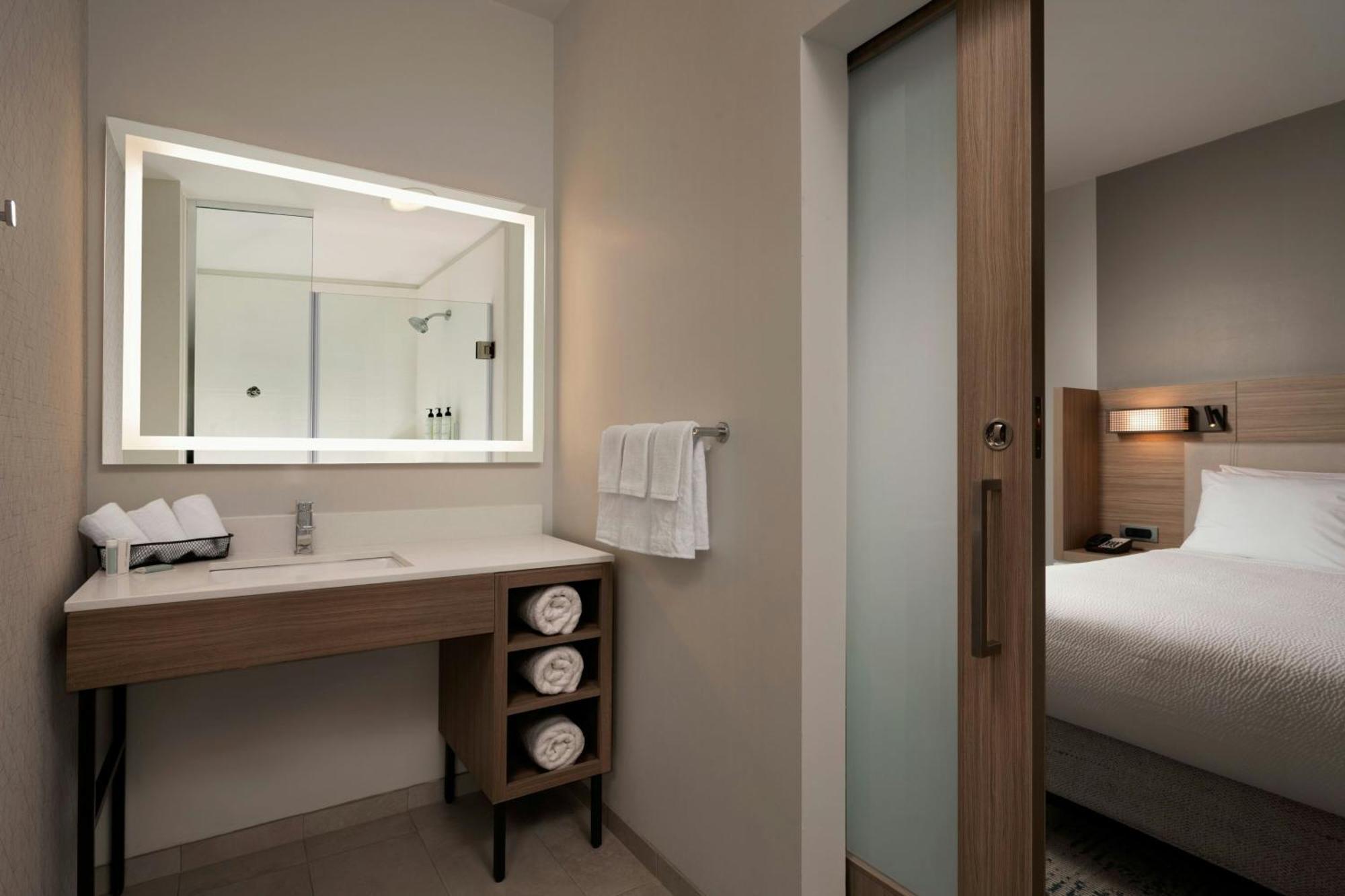 Queen Suite Two Queen Beds Roll Shower Transfer Shower Trundle Sofa Mobility Access or Hearing Accessible