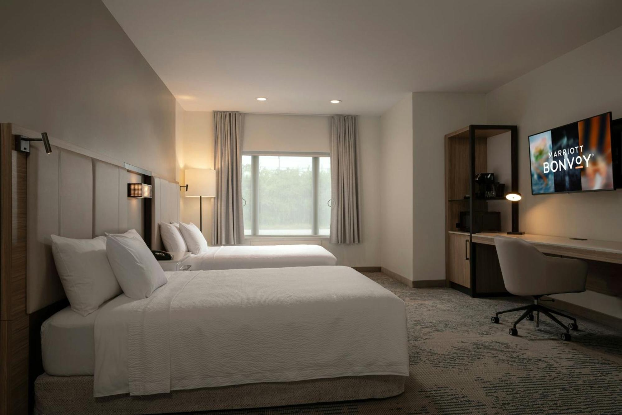 Queen Suite Two Queen Beds Roll Shower Transfer Shower Trundle Sofa Mobility Access or Hearing Accessible