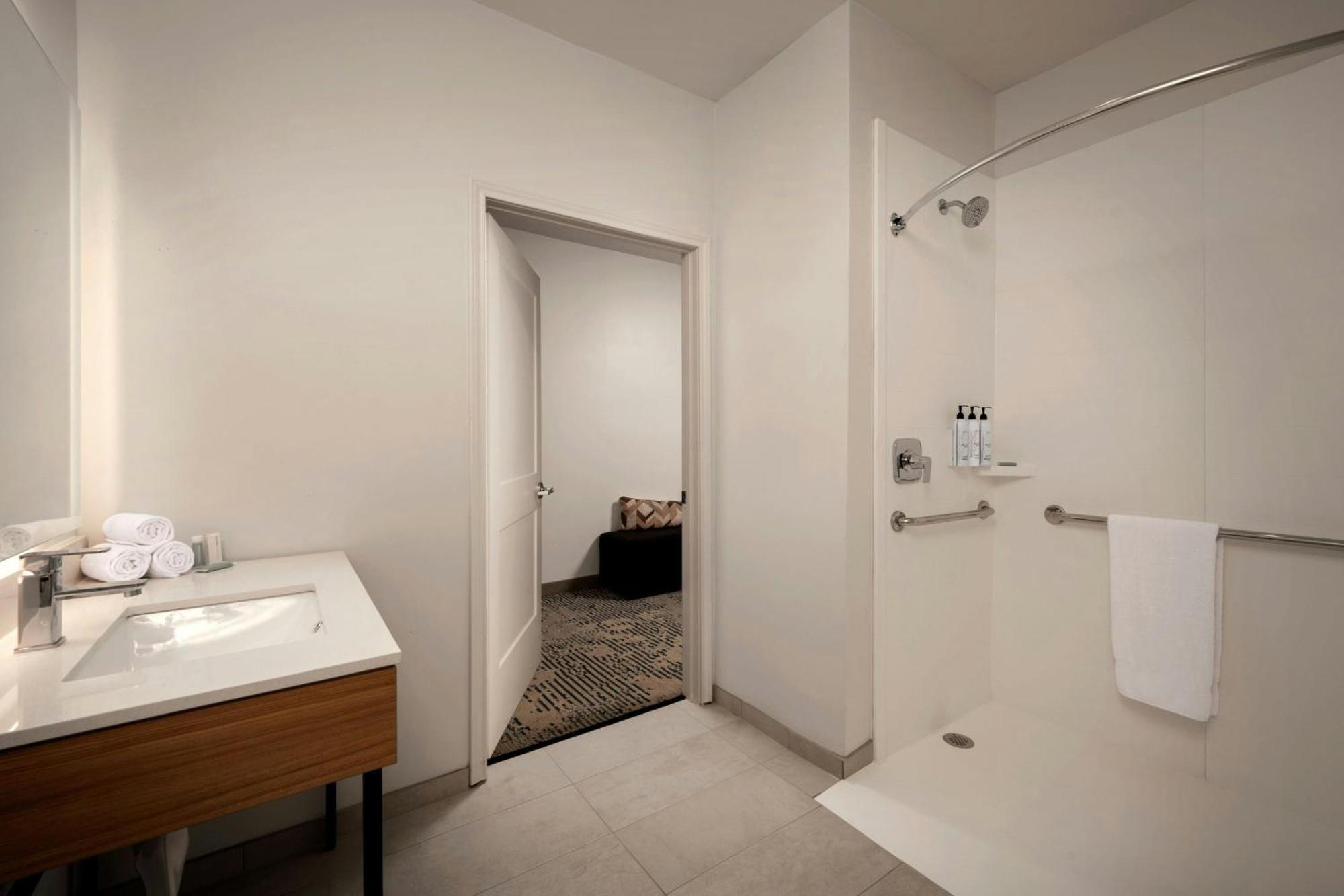 Queen Suite Two Queen Beds Roll Shower Transfer Shower Trundle Sofa Mobility Access or Hearing Accessible