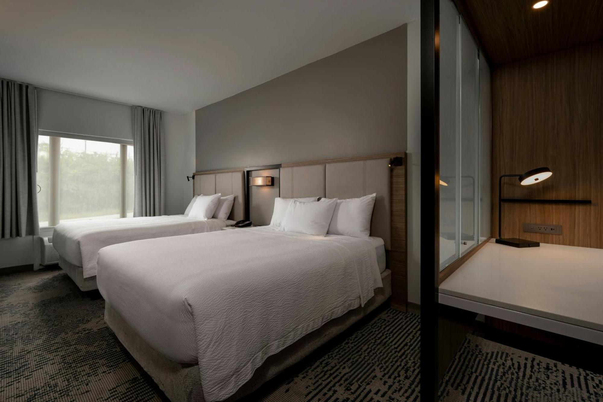 Queen Suite Two Queen Beds Roll Shower Transfer Shower Trundle Sofa Mobility Access or Hearing Accessible