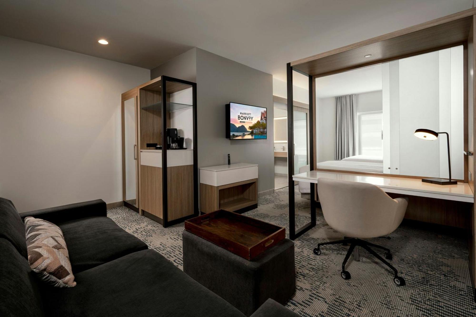 Queen Suite Two Queen Beds Roll Shower Transfer Shower Trundle Sofa Mobility Access or Hearing Accessible